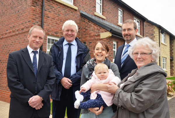 Claire Bainbridge and nine month old daughter Grace, welcome representatives from Kirkby Stephen Town Council, Eden District Council and Story Homes for a tour of the new market led and affordable housing at Birkbeck Gardens, Nateby Road, Kirkby Stephen.